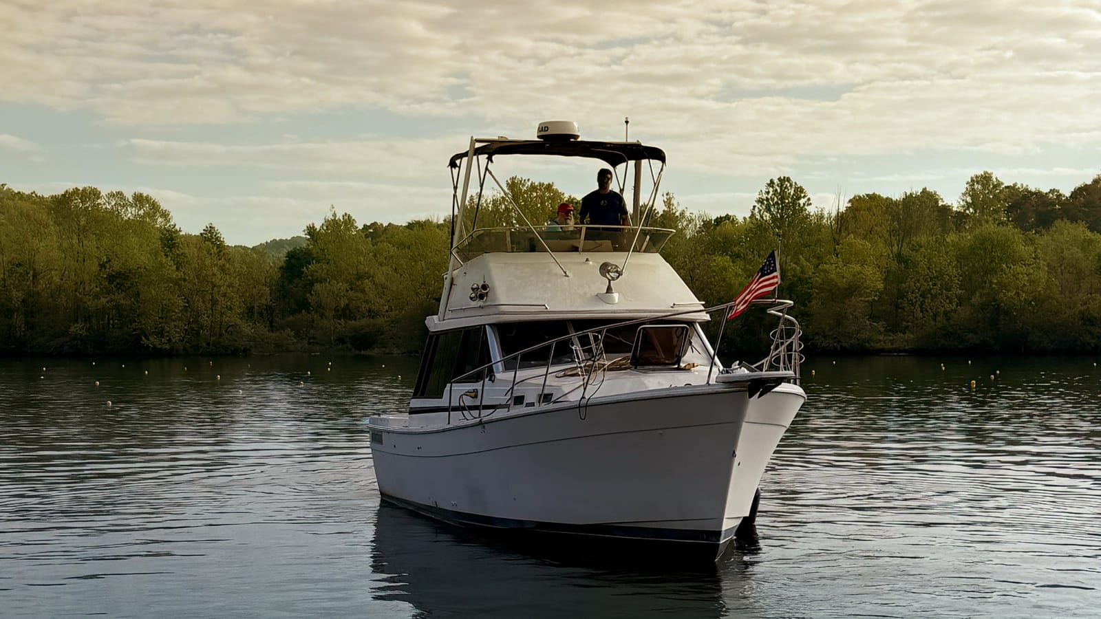 Leave Right, the Floating Lab Makers boat, on the river at golden hour