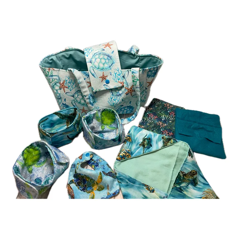 Doll diaper bag set with matching diapers, bibs and blankets